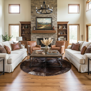 A round cowhide rug with a central star pattern and bison filler, in shades of brown.