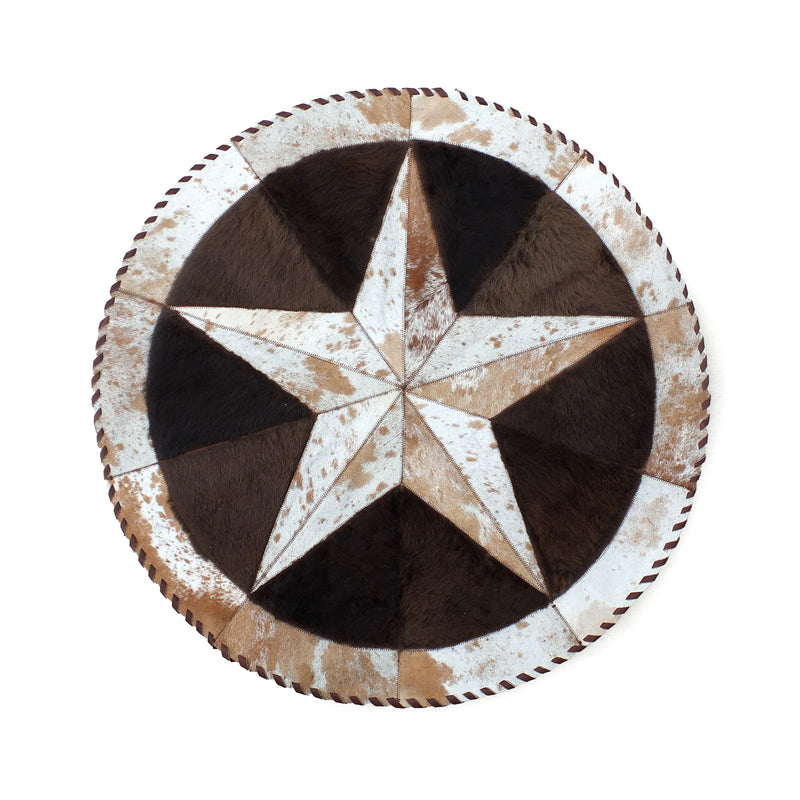 Round brown cowhide rug with a central star pattern and a speckled appearance.
