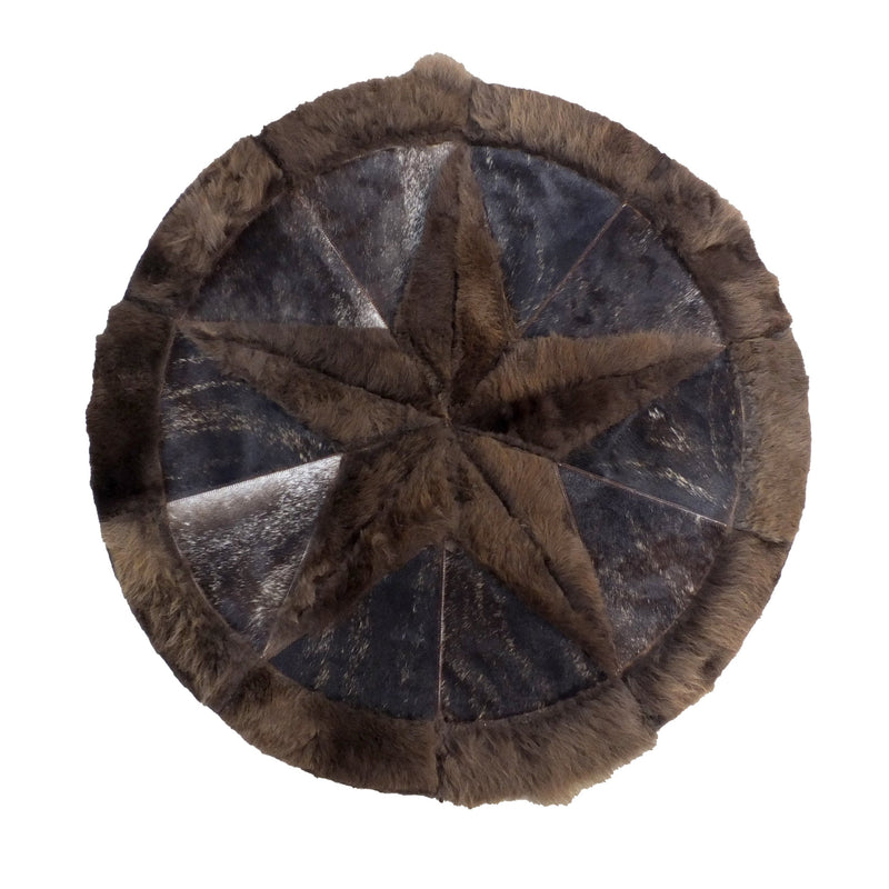 A round cowhide rug with a star pattern in a brindle color.