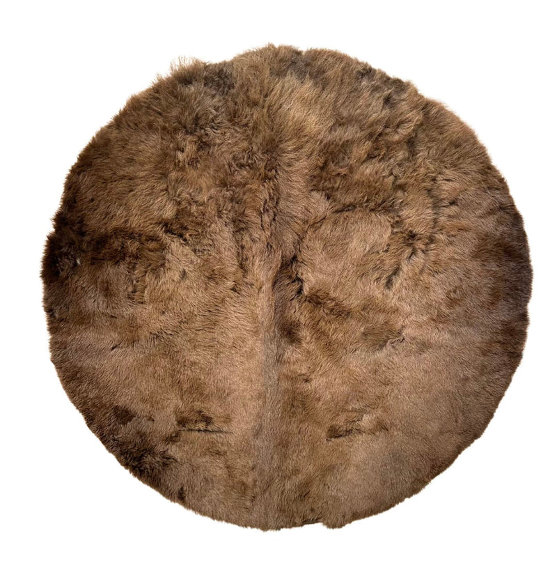 round bison rug on white background.