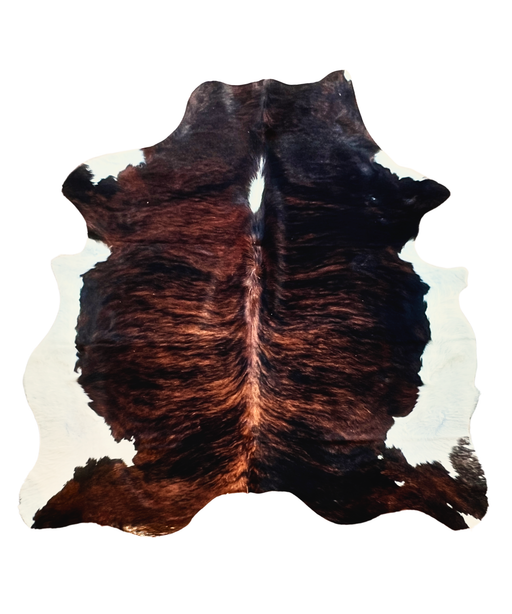 Brown brindle and black cowhide rug on a white background