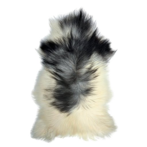 A plush Icelandic sheepskin rug with a mixture of black, gray, and white colors, featuring a natural, organic shape.