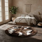 Round brown and white patterned rug in a bedroom with a bed and plant.